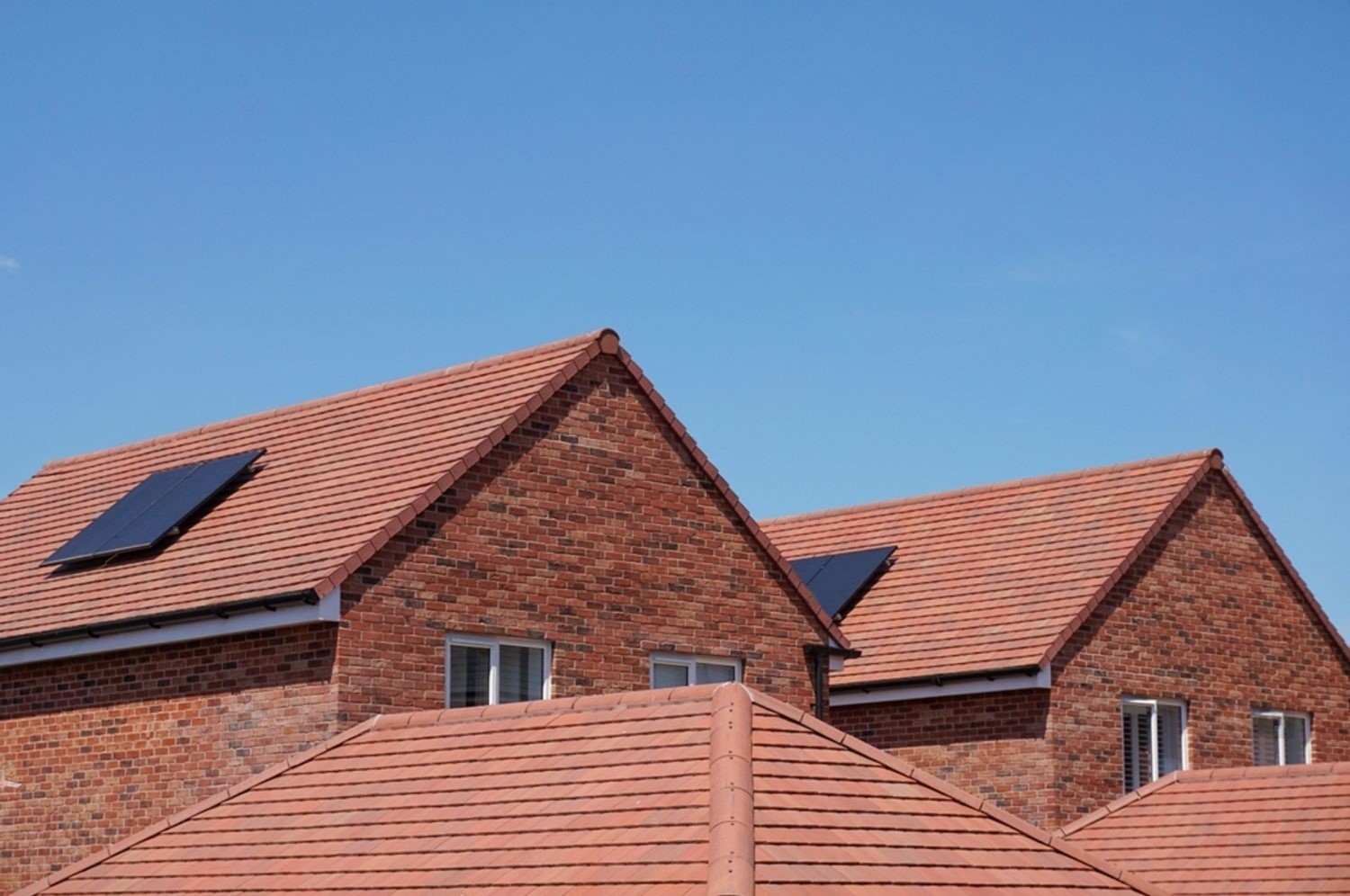 the pitched roof of a modern residential building